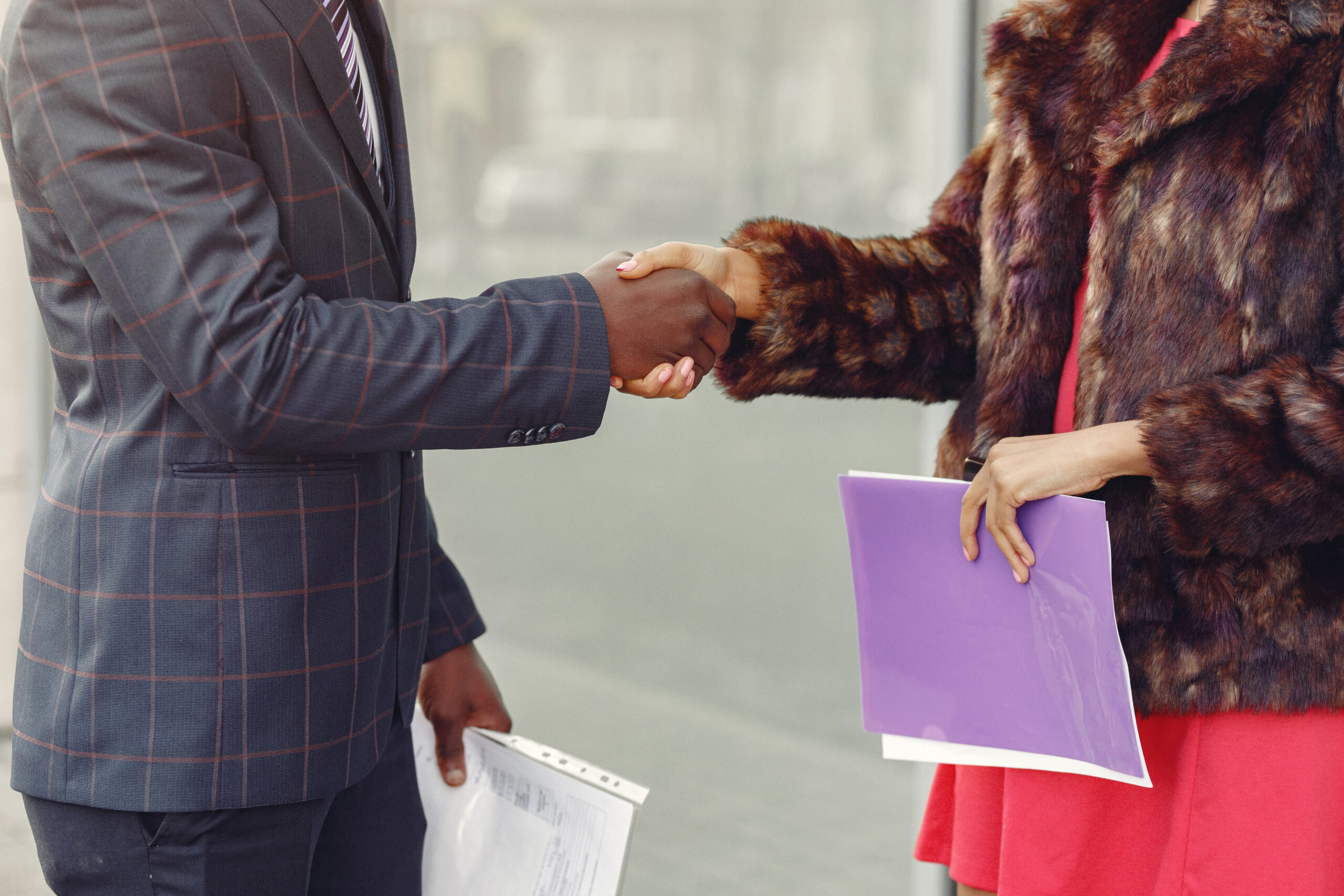 Stylish black couple have business conversation