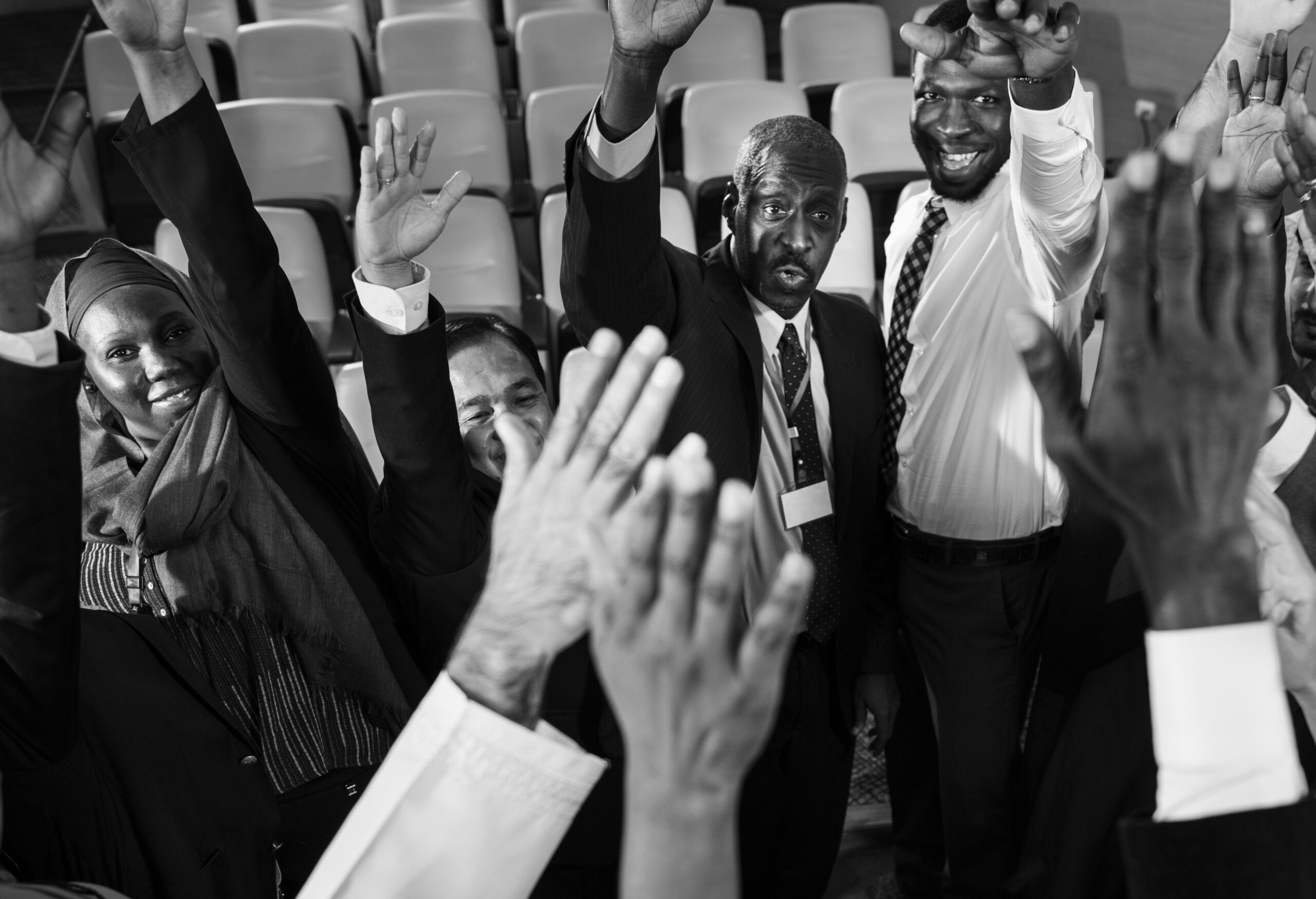 Group of International Business People Raising Their Hands